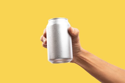 Man,Holding,Aluminum,Can,On,Yellow,Background Man,Holding,Aluminum,Can,On,Yellow,Background
